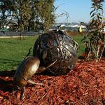 Bronze Dung Beetle Pushing a Steel Ball with Miscellaneous steel and bronze parts from the Artists Studio titled "Shop Shit".